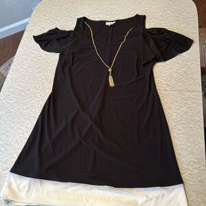 Black CB dress with cold shoulder style and attached bauble. Sized Medium.